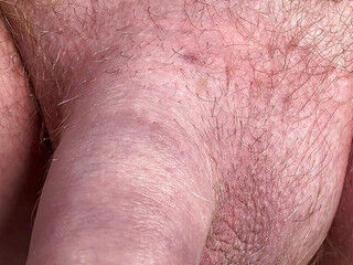 Cock head peeking out of foreskin as I piss