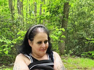 Sucking on a Straw in the Woods Squirting on Tree on Her Knees