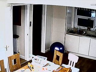 IP webcam plus-size walking around kitchen