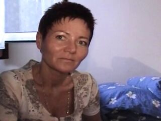 Short haired German woman pleasing her hairy labia with a dildo