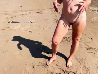Dominant woman having fun on the beach