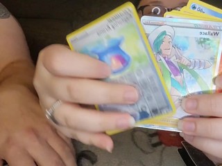 Plumper cougar and spouse open pokemon cards bare.