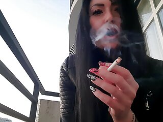 Smoking fetish from jaw-dropping domme Nika. Pretty girl blows ciggie smoke in your face